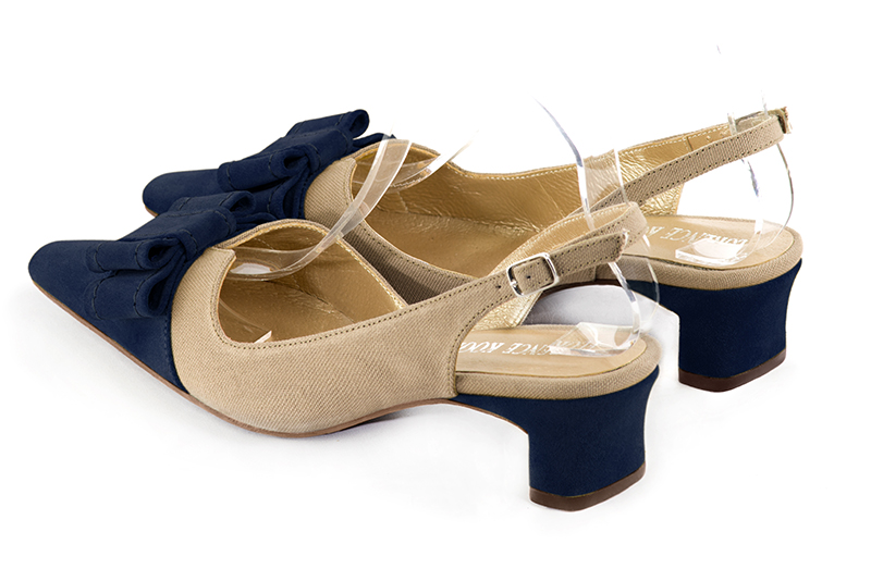Navy blue and tan beige women's open back shoes, with a knot. Tapered toe. Low kitten heels. Rear view - Florence KOOIJMAN